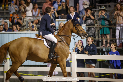 McLain Ward throws ribbon to youngsters