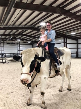 candid girl child on cowJefferis